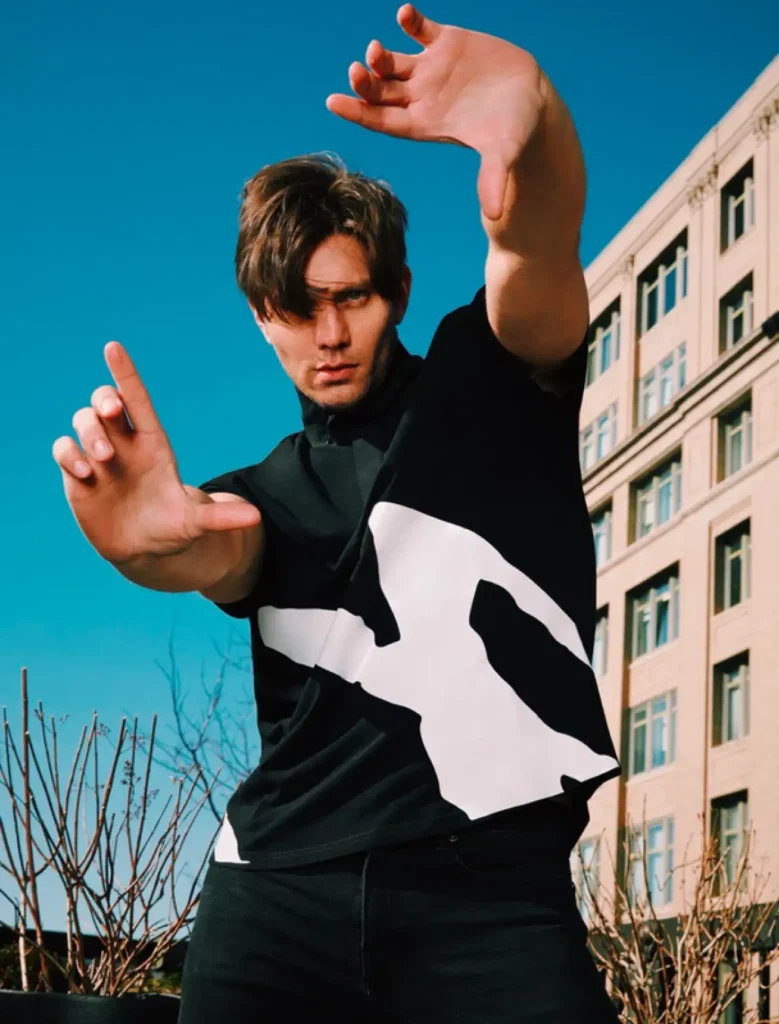 Don Hood wearing Foxylab New York black t-shirt with bold white abstract streetwear print
