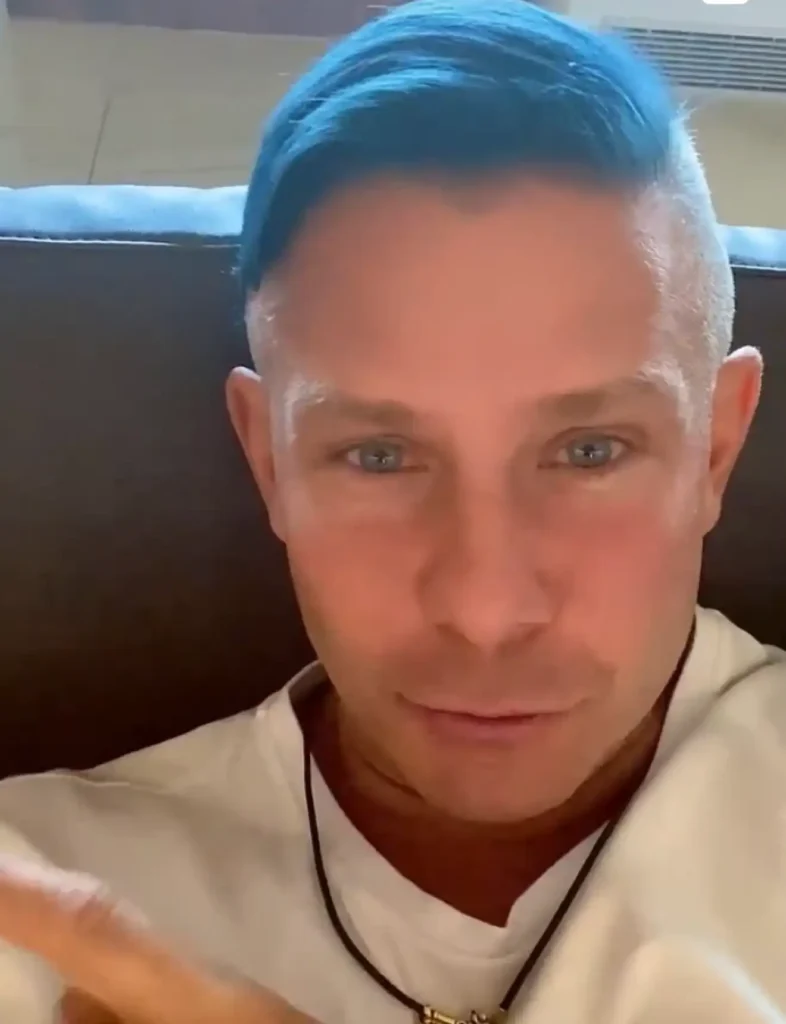 Mitya Fomin wearing Foxylab New York white hoodie in casual streetwear look.