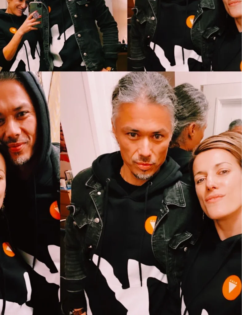 Olga Kedik wearing Foxylab New York black hoodie with white drip print design.