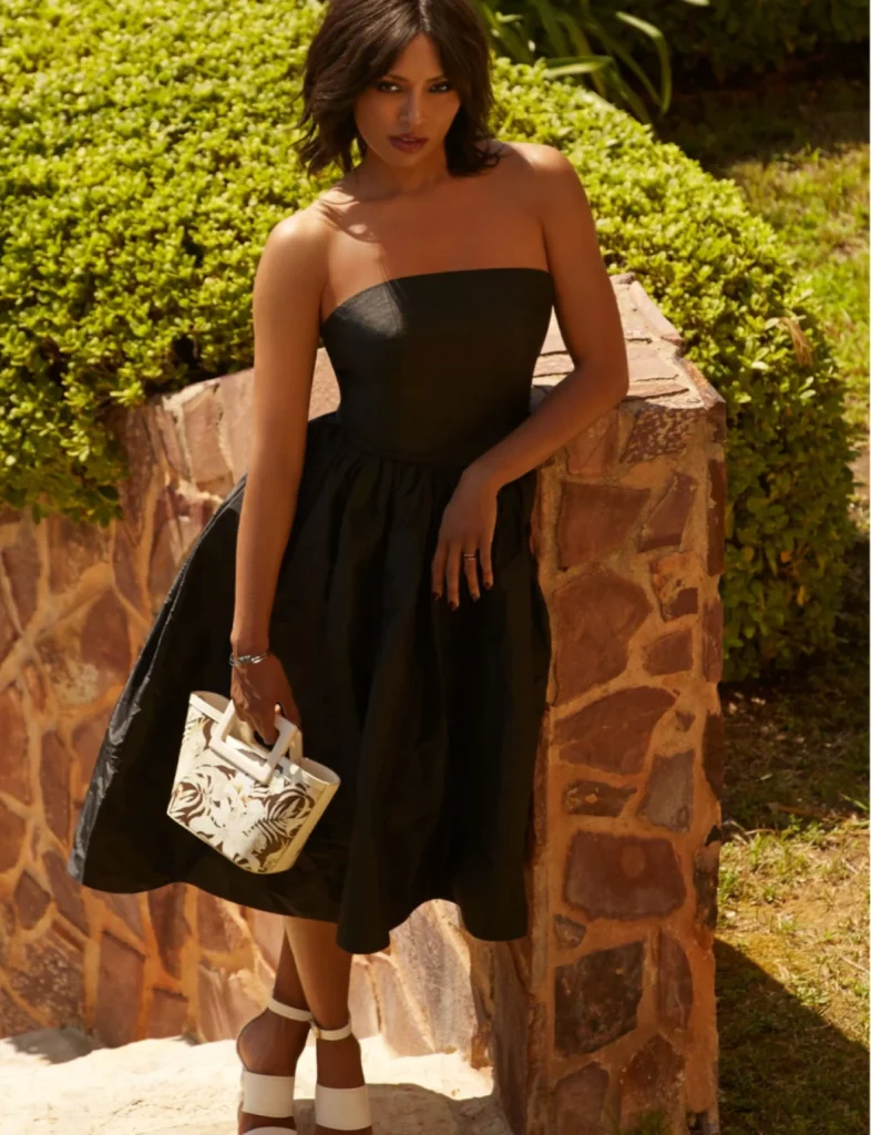 Kate Graham styling Foxylab New York strapless black dress with metallic handbag