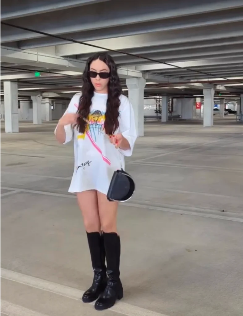 Anahys Ramos in Foxylab New York white oversized t-shirt with colorful graffiti-style print