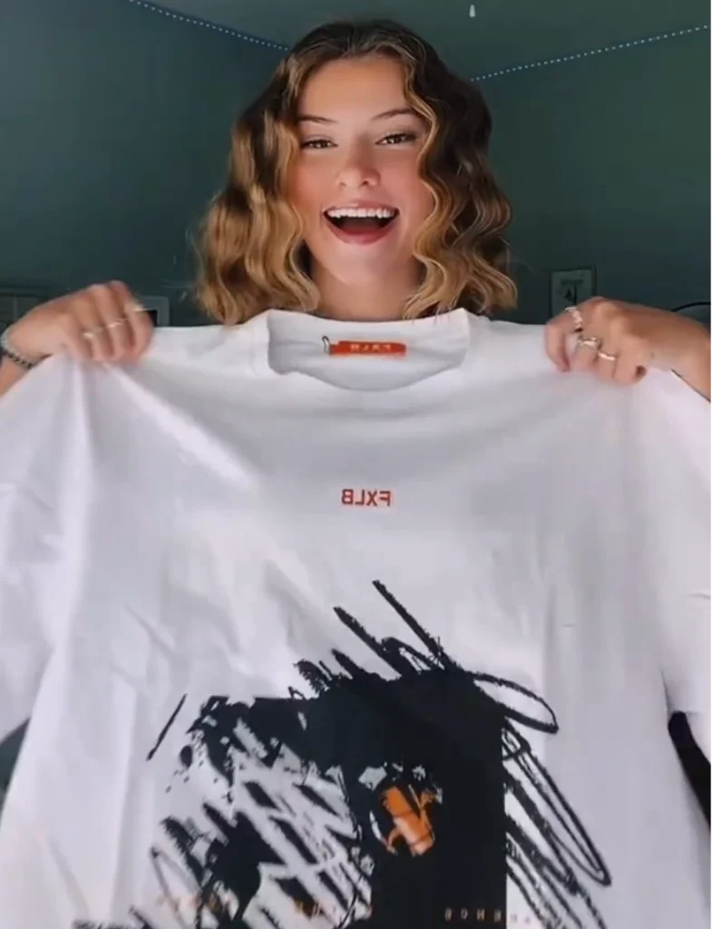 Averie Kat (Gilley) wearing Foxylab New York oversized white streetwear t-shirt with brushstroke graphic