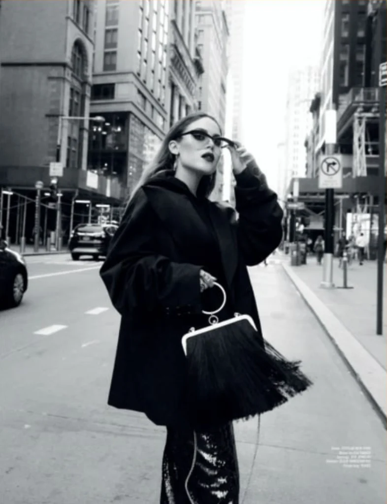 Yael Shelbia in Foxylab New York oversized black coat and sequin trousers in NYC street style.