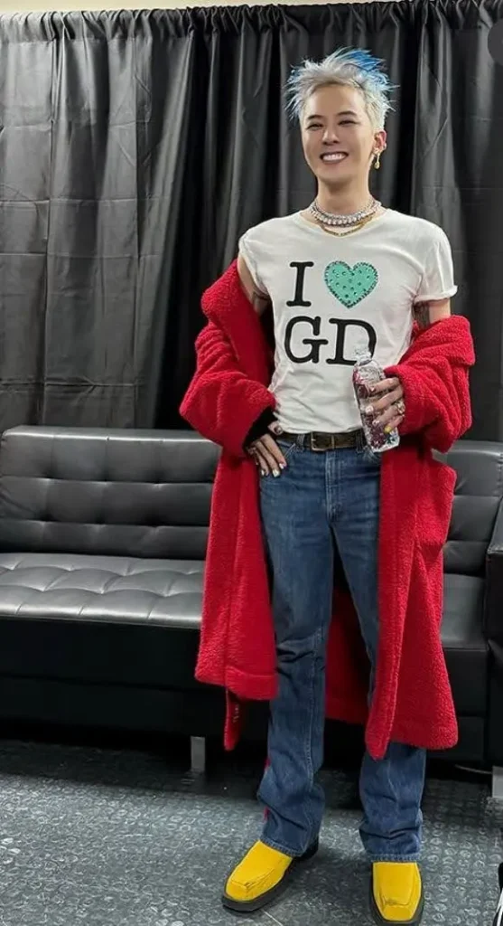 kpop singer wearing a gender neutral outfit.