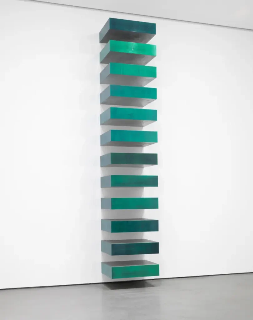 Minimalist art featuring a stacked, alternating red and white structure, emphasizing simplicity and form.