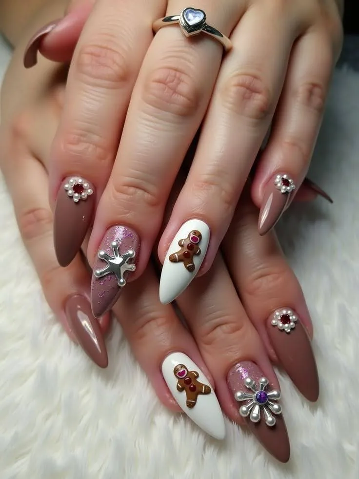 A female hand showing nails with 3D gingerbread nails art.