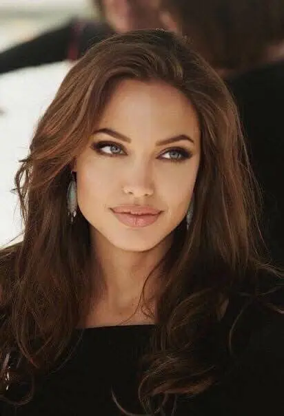A close-up of Angelina Jolie's face, highlighting her square jawline and cheekbones.