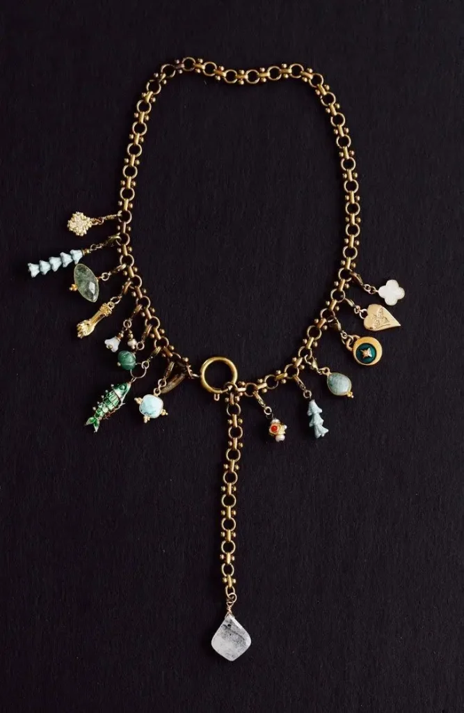 A charm necklace with a black background.