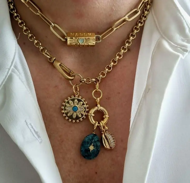 A woman wearing a boho charm necklace.