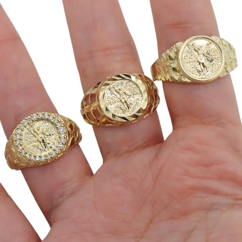 A man wearing three bold rings on fingures.