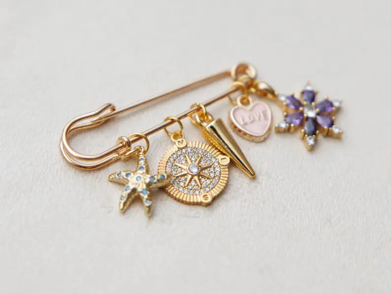 charm brooch on flat surface