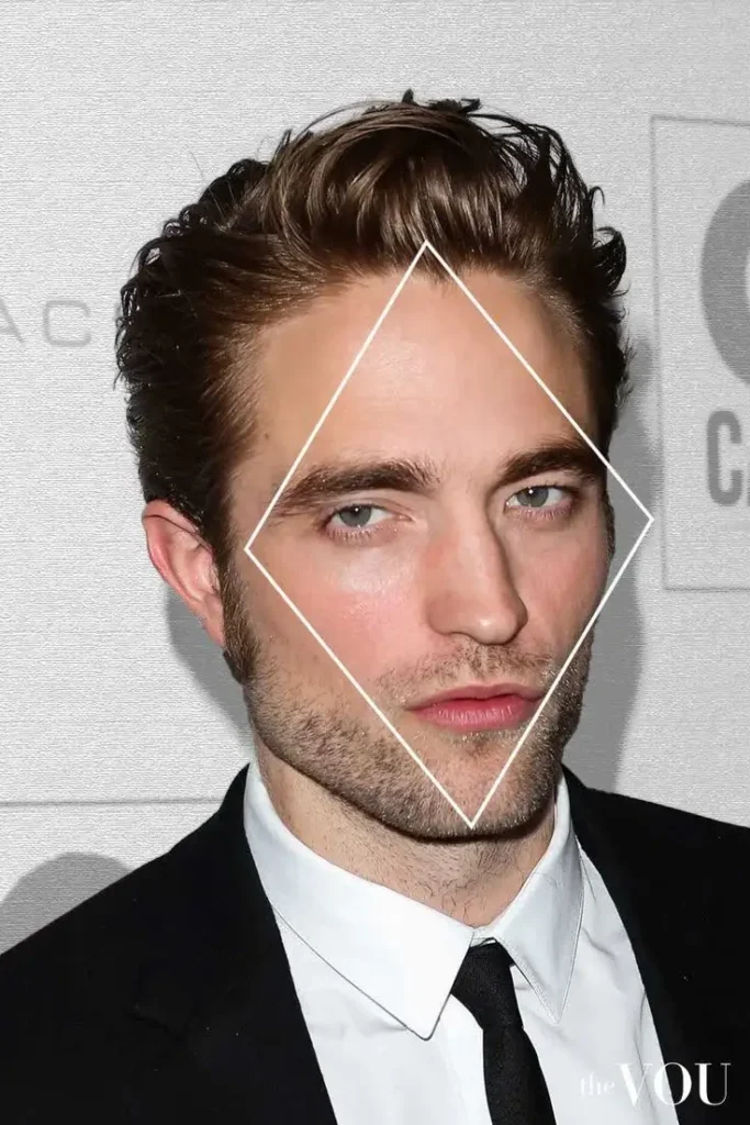 A close-up of Robert Pattinson's face, with a white diamond shape highlighting his diamond face shape.