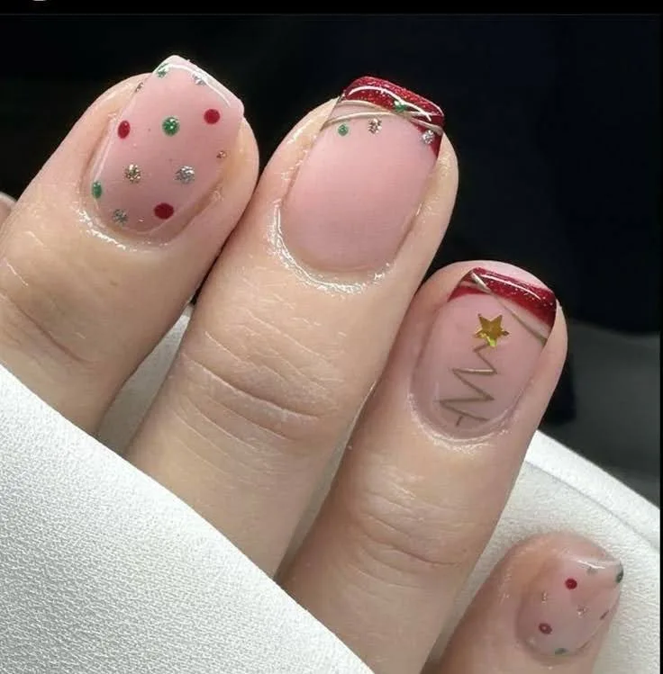 A female hand showing polka dot nails .