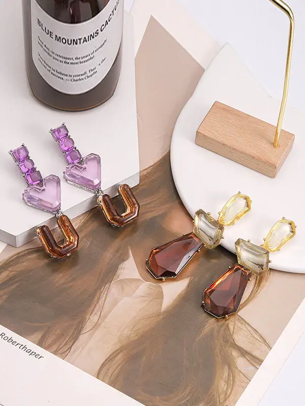 Two sets of gemstone earrings.