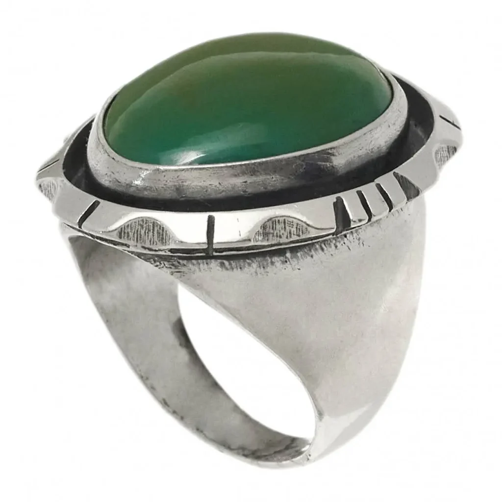 A man's bold ring with a unique stone.