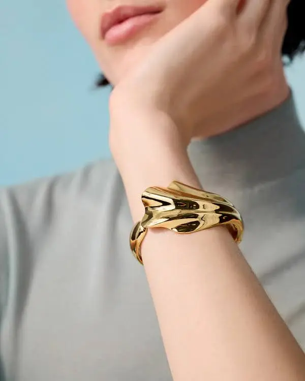 A woman wearing a trendy cuff.