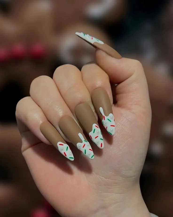 A female hand showing long nails with matte nail art.