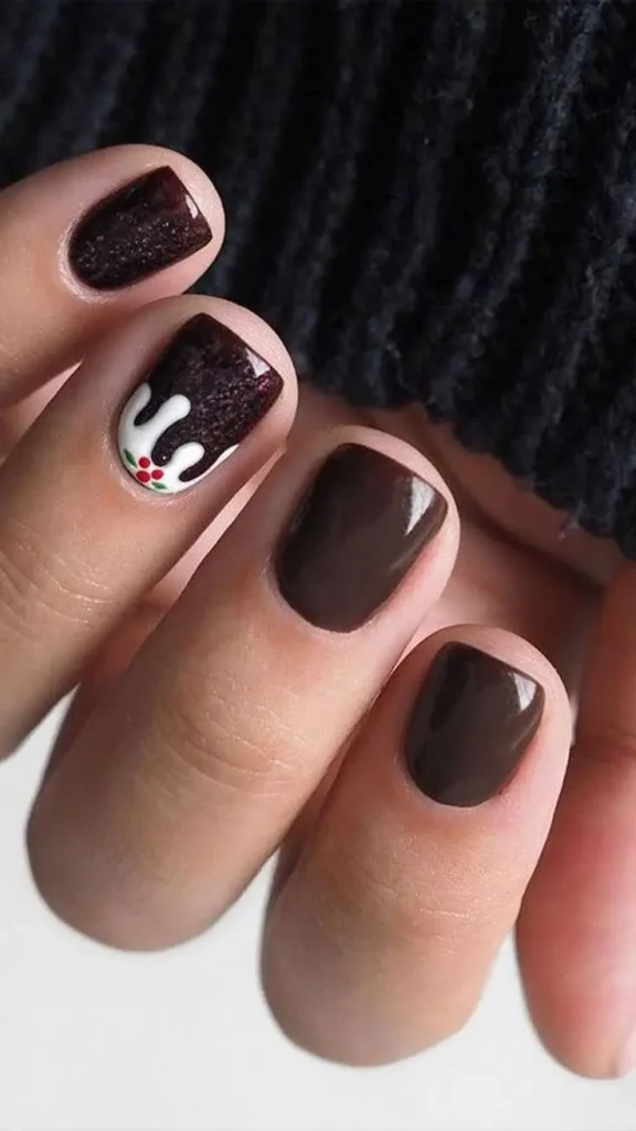A hand displaying minimalist nail art.