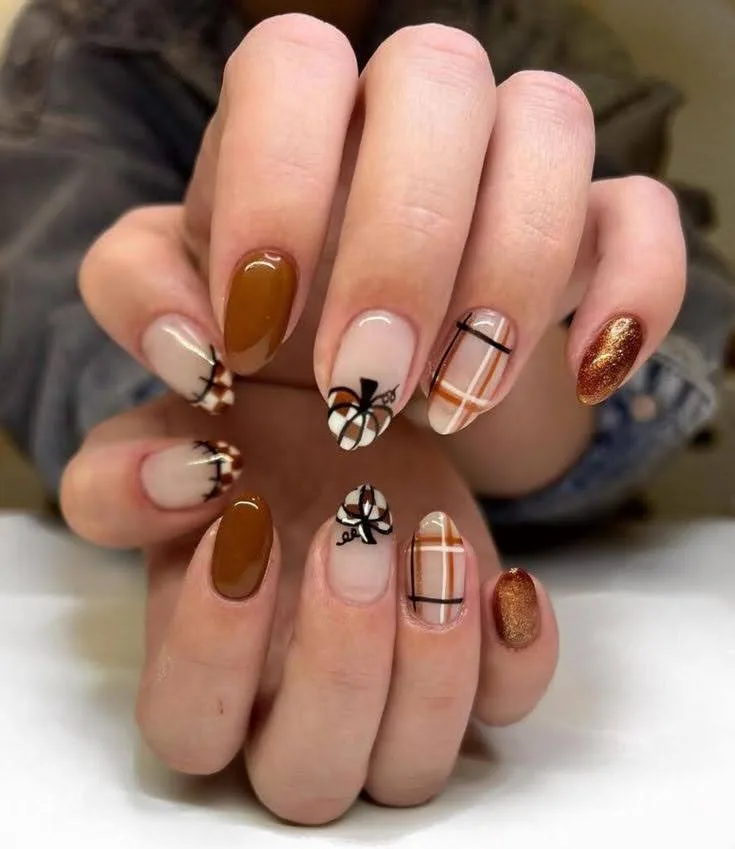 A female hand showing plaid nails .