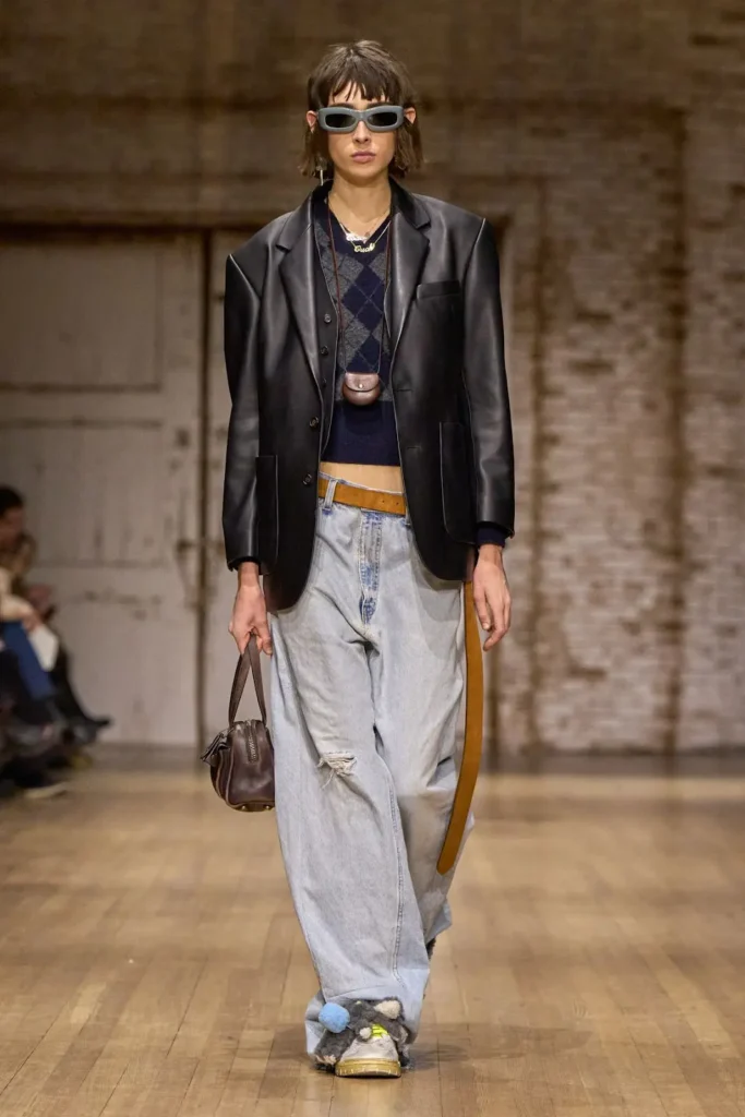 A ramp model representing Coach — NYFW Winter 2025 collection.