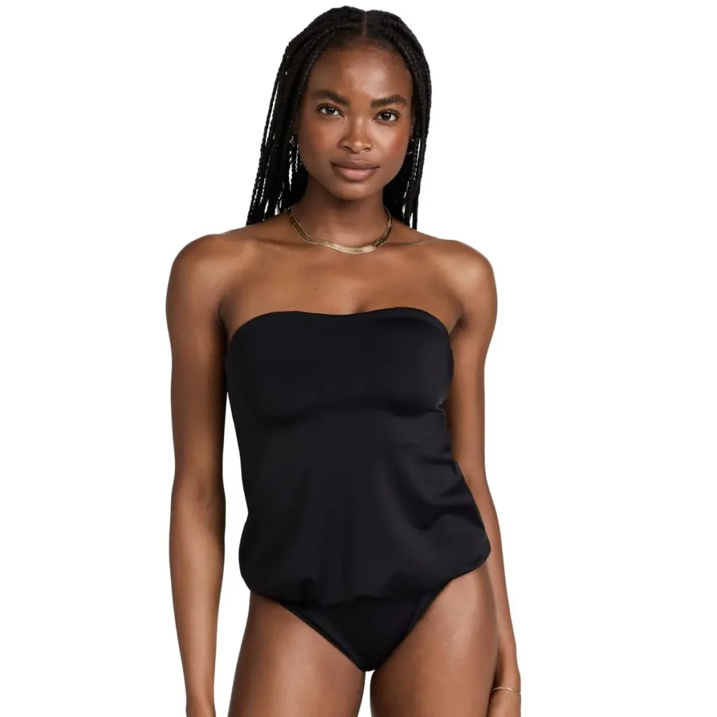 a girl wearing Norma Kamali Swimwear suite.