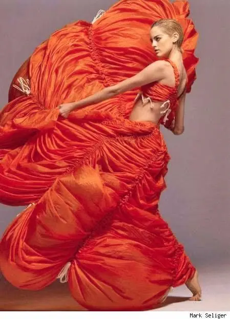 A model wearing Norma Kamali red Parachute