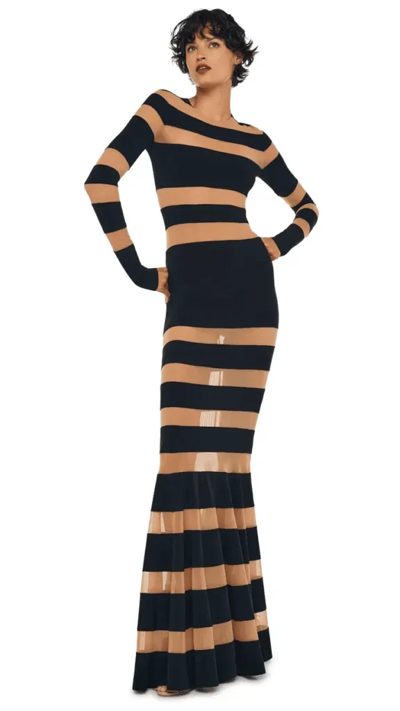 A model wearing Norma Kamali black fish tale suite