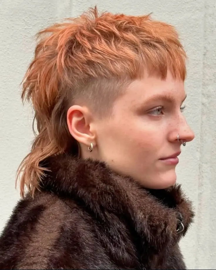 A girl with shaggy wolf cut hairstyle.