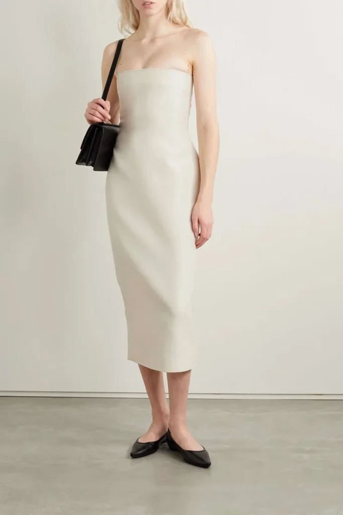a model wearing the row dreses and balletcore flat