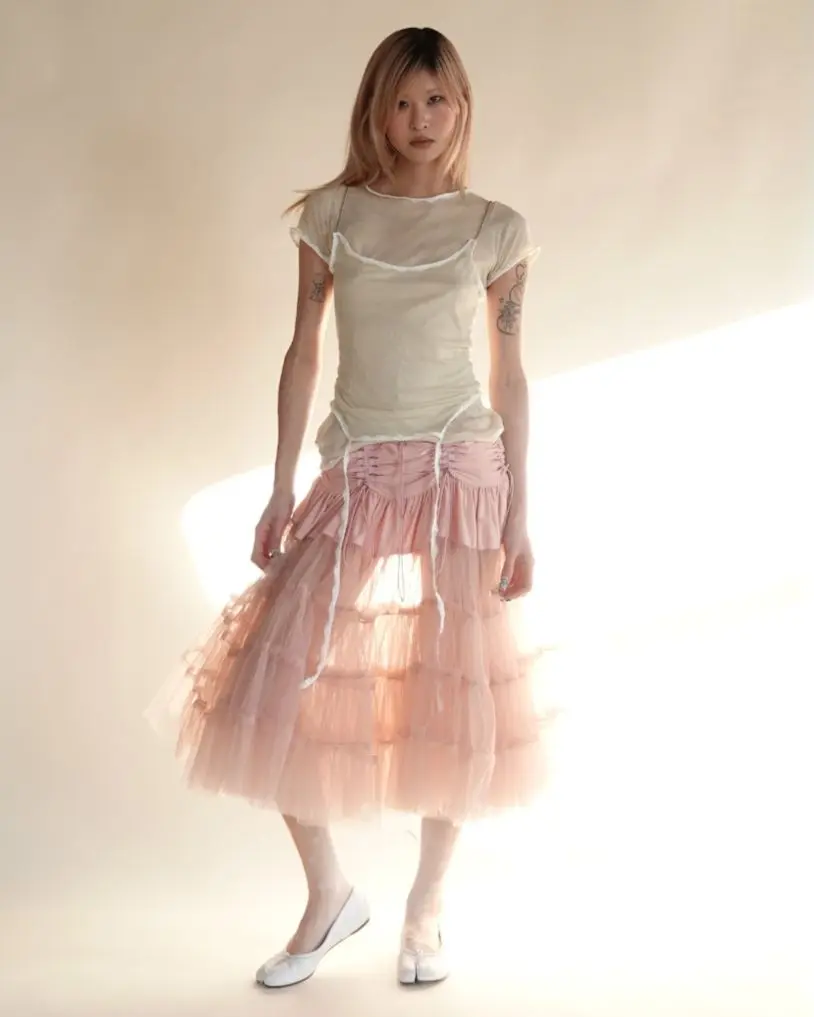 A girl wearing balletcore flowy skirt