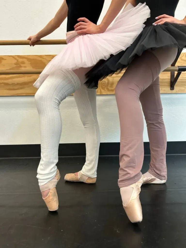 2 people wearing leg warmers