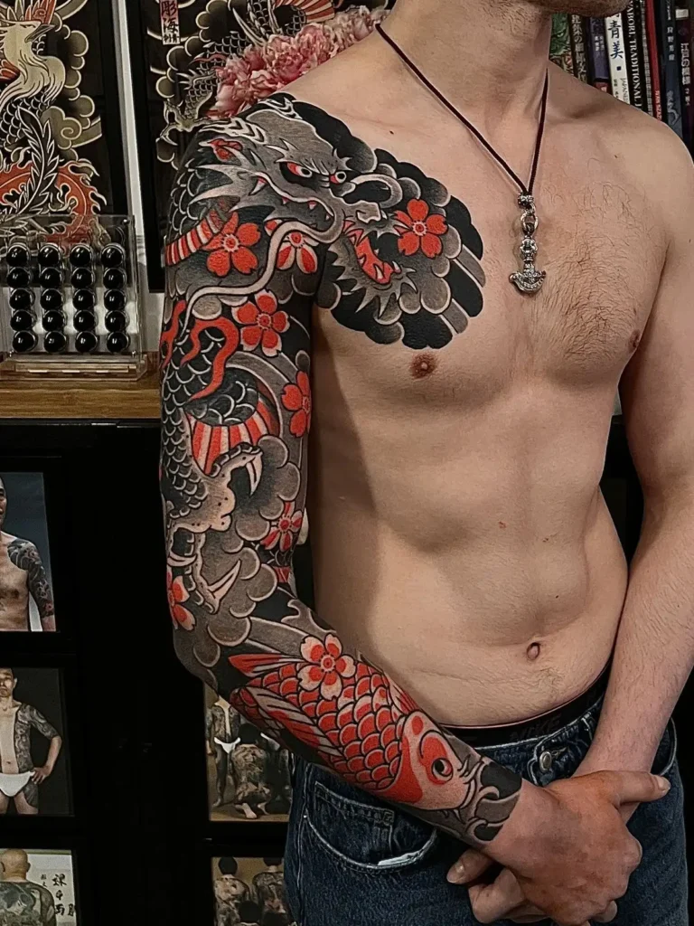 A boy with shoulder to wrist tattoo