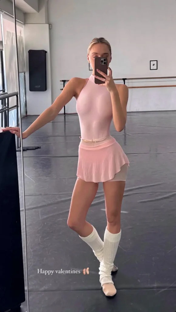 A girl posing in balletcore body suite