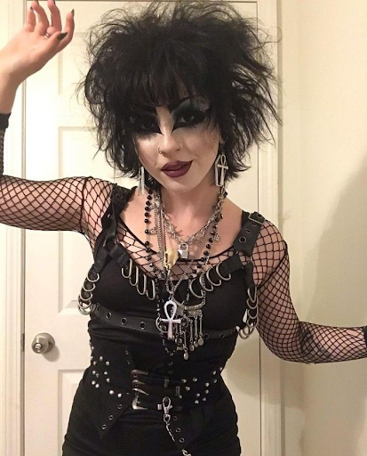 A girl in full trad goth style outfit