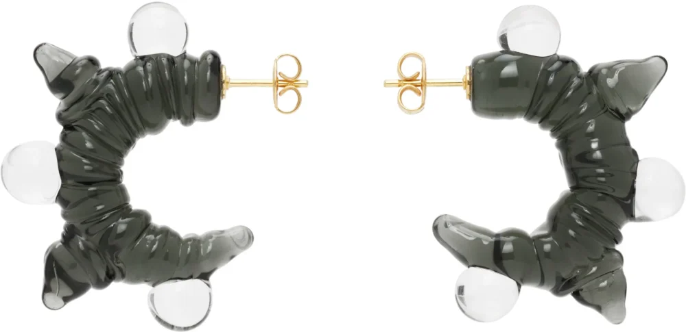 2 earings on flat surface