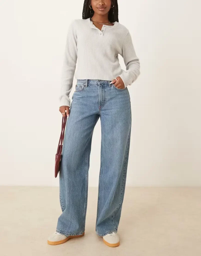 a girl with The High Low Tuck with jeans