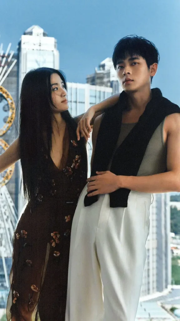 2 chinese male and female actresses wearing modern chinese fashion dresses