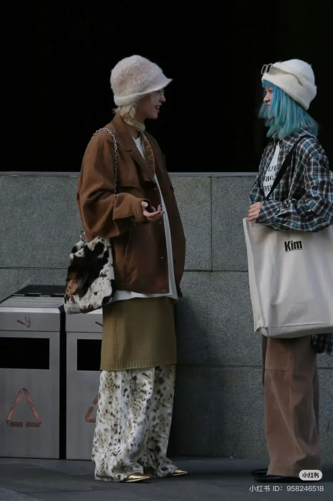 2 girls in a street talking to each other wearing Chinese Streetwear Fashion