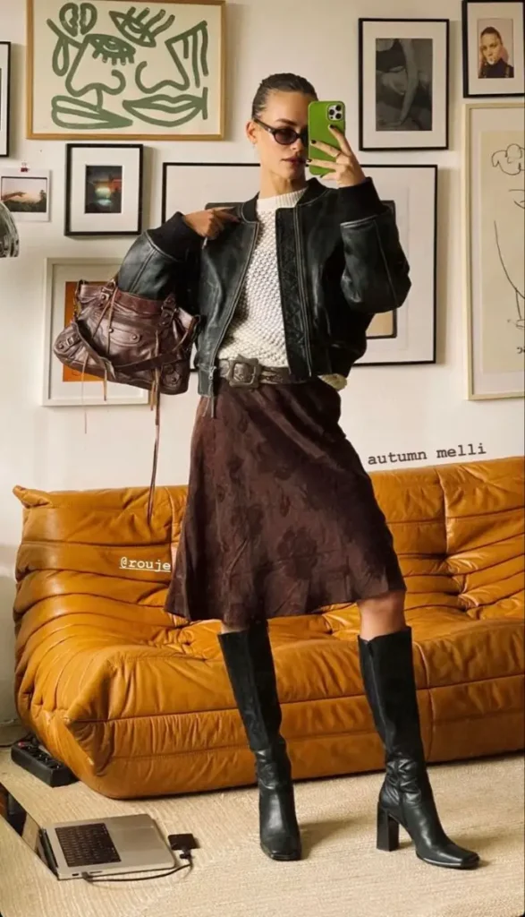 a girl posing in mirror taking selfie nd showing her boho chic fashion dress