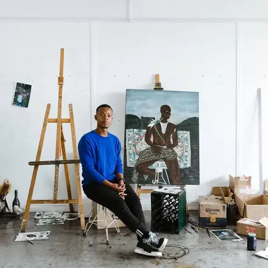 Cinga Samson From South Africa sitting close to his painting