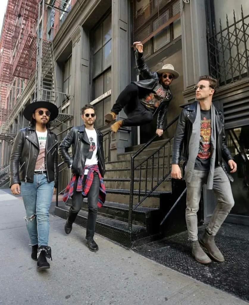 4 boys in different concert fashion outfitts