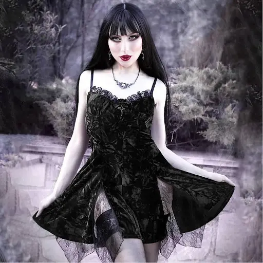 a girl in gothic dress and makeup