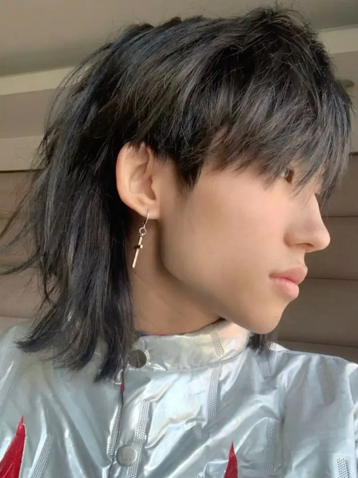a boy with kpop mullet haircut with ban korean style