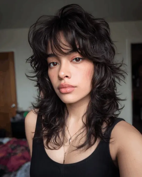 a girl with shaggy mullet haircut