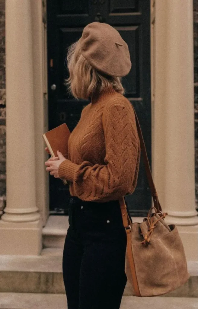 a girl side look holding a book