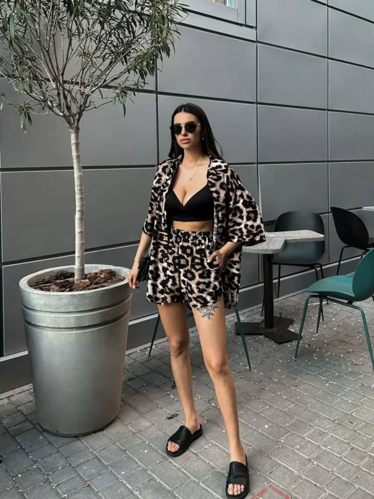 a girl wearing same leopard print dress uper and down