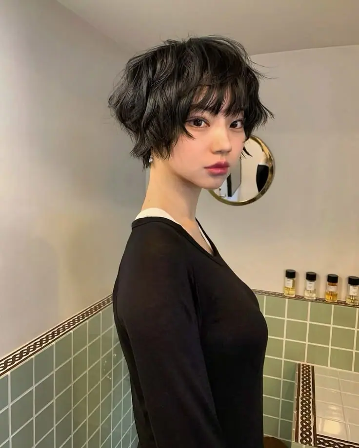 a girl with Bixie haircut with Bangs