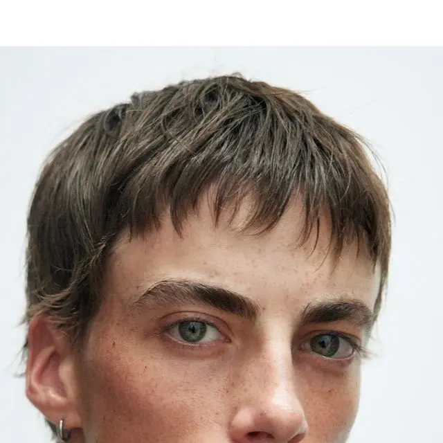 a boy with bixie hairstyle