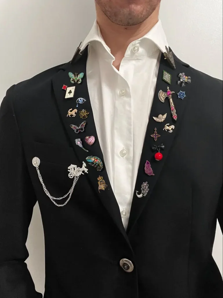 alot og brooches for men on a blazer
