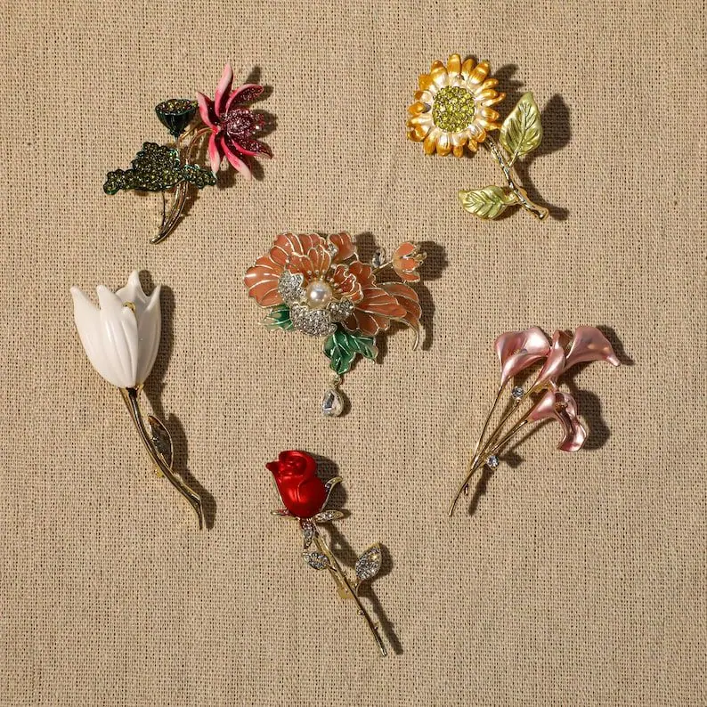 different type of floral brooches